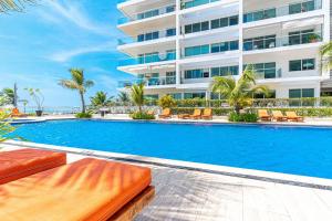 a swimming pool in front of a building at Morros 3 in Cartagena de Indias +51 photos