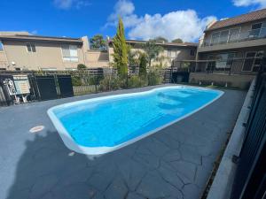 a swimming pool in a yard with a house at The Esplanade 4 Free Wifi And Foxtel in Inverloch