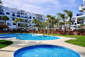 The swimming pool at or close to Aguacate Beach Apartamentos Playa Granada
