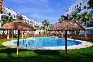 The swimming pool at or close to Aguacate Beach Apartamentos Playa Granada