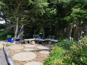 a garden with a picnic table and a picnic table at 8 person holiday home in Harbo re in Harboør