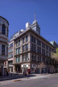 a large building on a street in a city at Master suite steps from Bellas artes in Mexico City