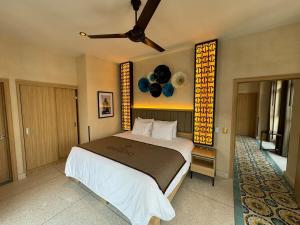 a bedroom with a large bed and a ceiling fan at Master suite steps from Bellas artes in Mexico City