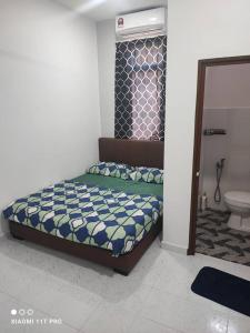 Ένα ή περισσότερα κρεβάτια σε δωμάτιο στο SuZa River Homestay