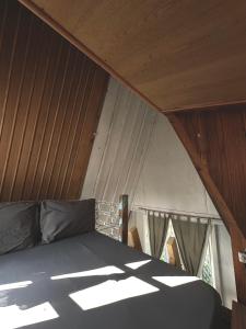 Ένα ή περισσότερα κρεβάτια σε δωμάτιο στο Dreamer Cabin Tre house Dalat +30 φωτογραφίες