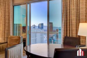 a conference room with a table and a large window at MGM Signature-36-705 F1 Track & Strip View Balcony in Las Vegas