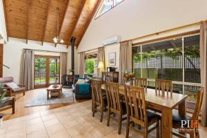 a dining room and living room with a table and chairs at Charming 3-Bedroom Retreat in Cowes