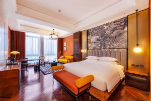 Postel nebo postele na pokoji v ubytování Fondney Hotel Shanghai NECC Hongqiao Airport T2 + 37 fotografií