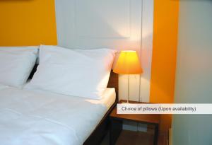 Uma cama ou camas num quarto em Hotel an der Aare Swiss Quality