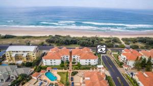 an aerial view of a beach with houses and the ocean at Beach Break in Yamba
