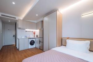 Katil atau katil-katil dalam bilik di 上海客堂涧酒店宝山路地铁站店