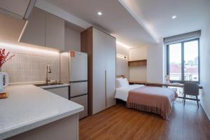 Katil atau katil-katil dalam bilik di 上海客堂涧酒店宝山路地铁站店