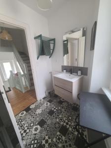 a bathroom with a sink and a mirror at MARCELINE in Lannion +15 photos