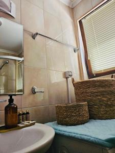 a bathroom with a sink and a mirror at Apartment 7 and Studio 2 Quietly and peaceful place to relax in Sozopol