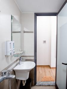 a bathroom with a sink and a mirror at Phuong Nam Luxury Hotel Long Bien in Hanoi +85 photos