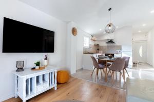 a living room with a flat screen tv on a wall at Marin Novigrad in Novigrad Dalmatia