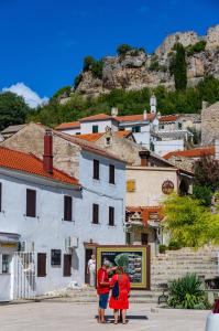 a group of people standing in front of a building at Marin Novigrad in Novigrad Dalmatia