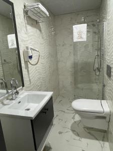 a bathroom with a sink and a toilet and a shower at Mi Hotel Boutique in Antalya
