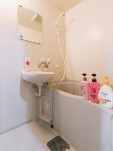 a bathroom with a sink and a bath tub at Diamante Yakuin - Vacation STAY 71963v in Fukuoka