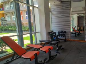 a gym with chairs and exercise equipment in a building at No Fixed Address in Marmagao