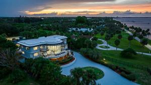 an aerial view of a resort with a river at 9000 SF Waterfront Mansion Pool Boat Dock Theater in Fort Pierce