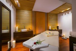 Кровать или кровати в номере Elysium Resort & Spa