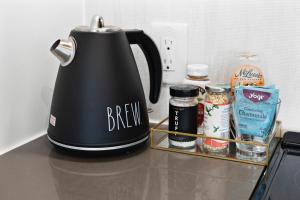 a black kettle sitting on a counter with some food at Boston Cambridge Suites Family Edition by Orchard in Cambridge