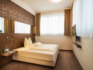TV a/nebo společenská místnost v ubytování Hotel Römerstube