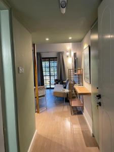 a room with a living room with a table and a couch at Calming Mountain View Apt with Balcony & Free Parking near Kakopetria in Nicosia