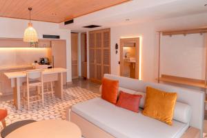 a living room with a couch and a kitchen at Novva Hotels Kas in Kas