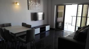 a dining room with a table and chairs at Rocha T Apartments in Portimão