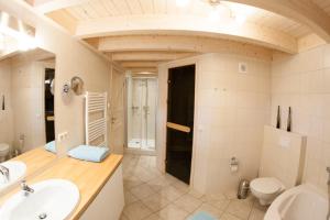 a bathroom with a sink and a toilet at Fischerwiege - Baabe in Baabe