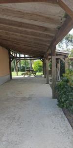 a patio with a picnic table in a park at Gîte spacieux, Proche Plage, Grand jardin in Neufchâtel-Hardelot