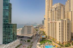 an aerial view of a city with tall buildings at Frank Porter - Dorra Bay in Dubai