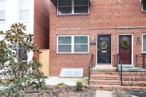 a brick house with a red door and stairs at Transit-Friendly Home Old Town Parking in Alexandria