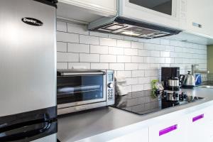a kitchen with a stainless steel counter top at Eastern Market Carriage house efficiency PRIVACY in Washington, D.C.