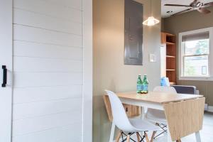 a kitchen and dining room with a table and chairs at Eastern Market Carriage house efficiency PRIVACY in Washington, D.C.