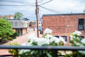 a view of a brick building on a street at Eastern Market Carriage house efficiency PRIVACY in Washington, D.C.