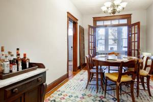 a kitchen with a table and chairs and a dining room at The E St Retreat Lovely 3-BR Nestled between H St & Eastern Market in Washington, D.C.