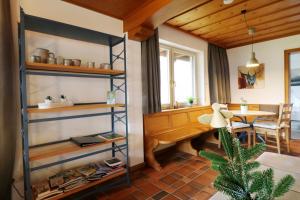 a room with a desk and a table in a room at Hus im Schwefelmättle, Hinterzarten in Hinterzarten