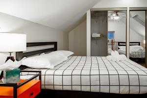 a bedroom with a white bed and a mirror at Pentagon City Homestay Parking available in Arlington