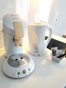 a white appliance sitting on top of a counter at Nymphe Strandhotel & Apartments in Binz