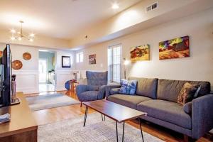 a living room with a couch and a table at Family-friendly Home for travelers Near subway in Washington, D.C.