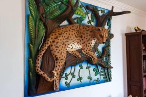 a painting of a jaguar on a wall at Villa Calafia Spacious Home w Private Tennis in Cabo San Lucas