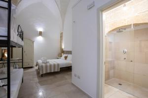 A bed or beds in a room at Casale Donna Rosa