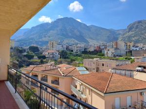 a view from a balcony of a city with mountains at La Finestra sul Golfo in Castellammare del Golfo