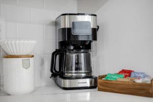 a coffee maker sitting on top of a counter at Excellent 2-BR Condo in Hip Area of DC in Washington