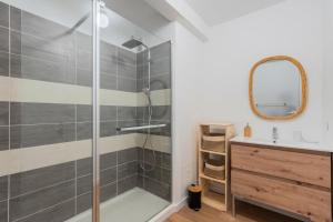 a bathroom with a shower and a sink at One bedroom apartment with balcony, city center in Tourcoing +7 photos