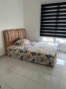 Ένα ή περισσότερα κρεβάτια σε δωμάτιο στο Danau Homestay