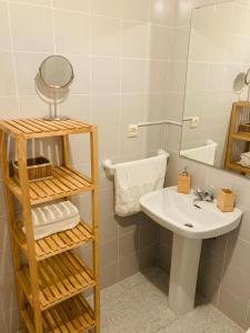 a bathroom with a sink and a mirror at Holiday Home La Atalaya de Conil in Conil de la Frontera